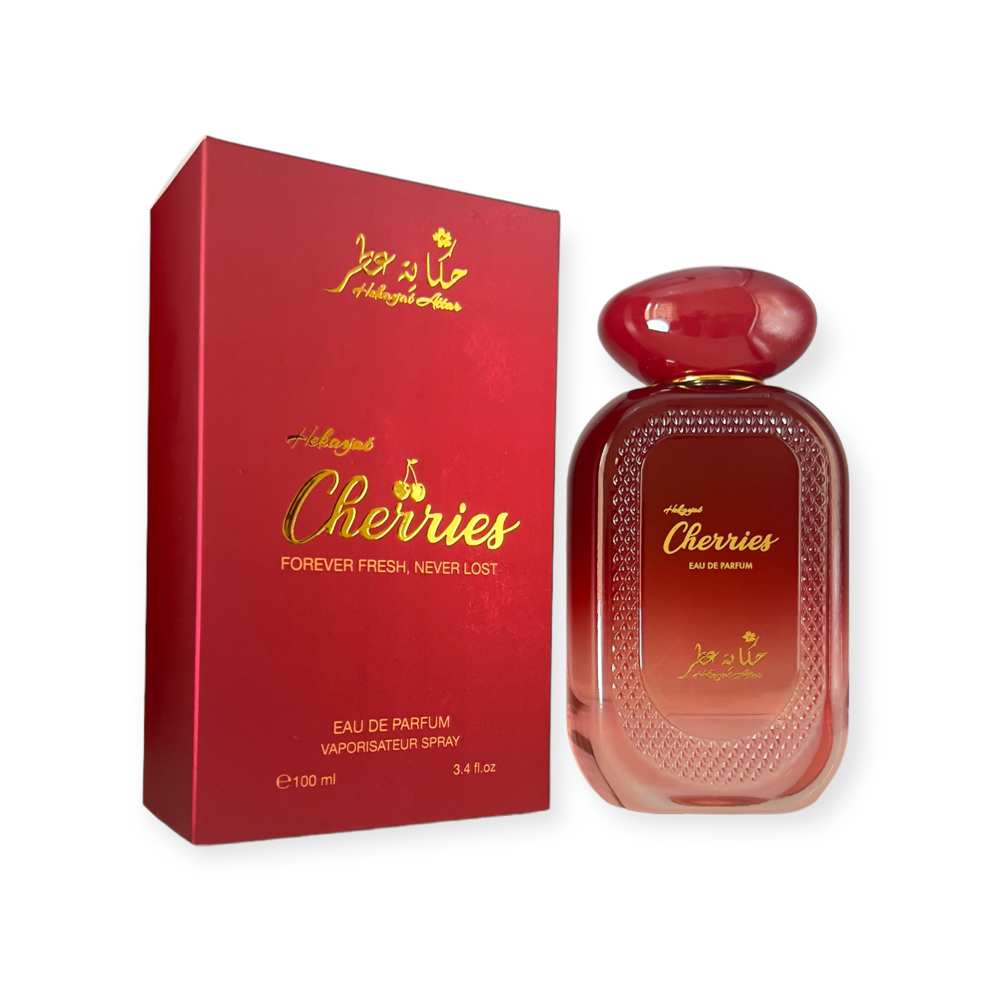 Cherries by Hekayat Attar bottle with packing on a white background