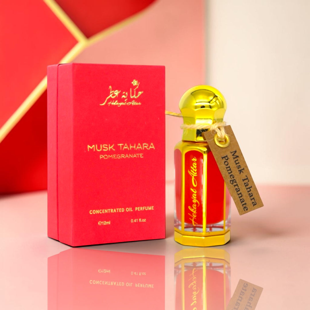 hekayat attar branded musk tahara pomegranate displayed on a table 
