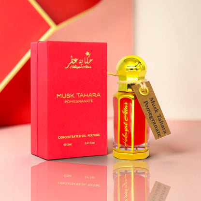 hekayat attar branded musk tahara pomegranate displayed on a table 
