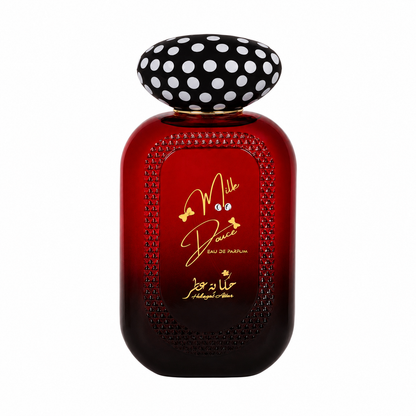 A bottle of Mille Douce Eau de Parfum by Hekayat Attar with a dark red gradient glass body, gold lettering, and a black cap with white polka dots, set against a plain white background.