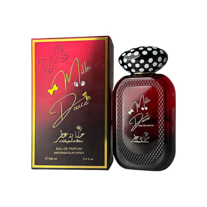 Mille Douce Eau de Parfum by Hekayat Attar and its red gradient packaging box with gold accents and a polka-dot cap, set against a plain white background.