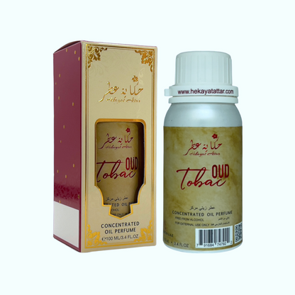 Oud Tobac by hekayat Attar bottle with packaging on a white background