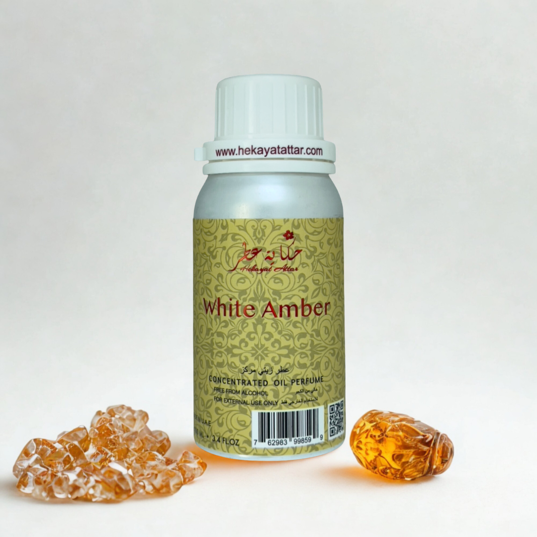WHITE AMBER by Hekayat Attar bottle with luxury background